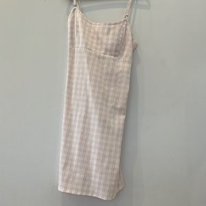 summer dress from Brandy Melville. I’m 5 feet and it falls just above my knees.